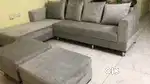 5-seater L-shaped sofa with cushions and 2 puffies