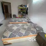 Bed with mattress and side table