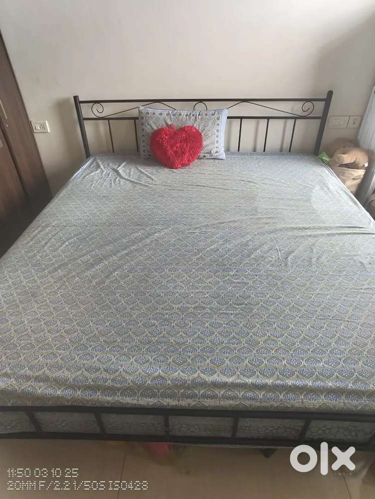 Black iron double bed