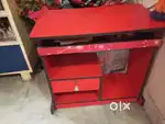 Red coloured computer cum study table
