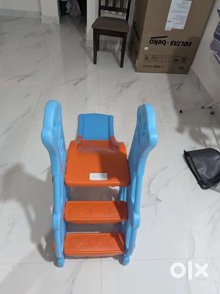 Kids slide with baby carrier.