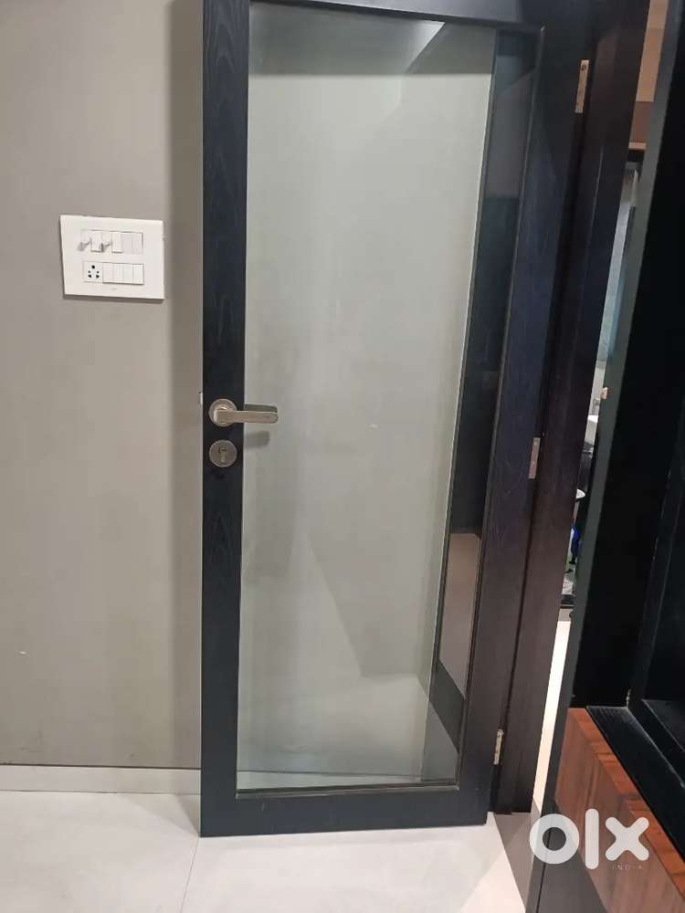 Wooden door with toughened glass