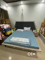 Almost new bed for sale with back