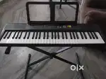 Yamaha f 52 keyboard with stand and cover