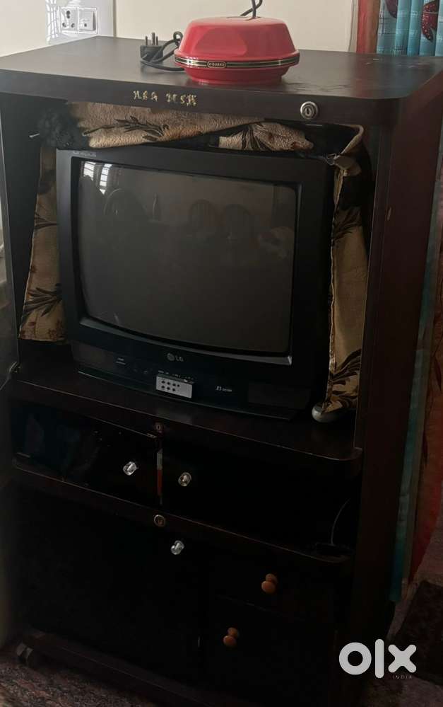 LG tv along with stabilizer and TV stand