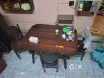 Bed, dining table including 4 chairs, reading table and a showcase