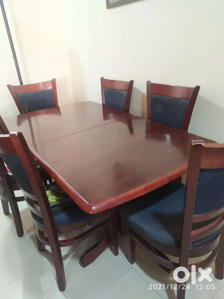 MALASIAN WOODEN DINING TABLE  IN GOOD CONDITION.