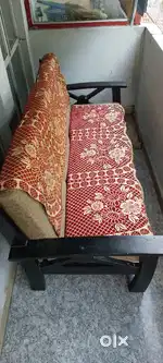 Wooden 3 Seater Sofa with pillows and fancy sofa cover