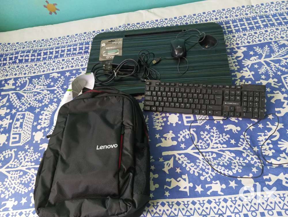 Laptop bag, pendrive, mouse, keyboard, and charger