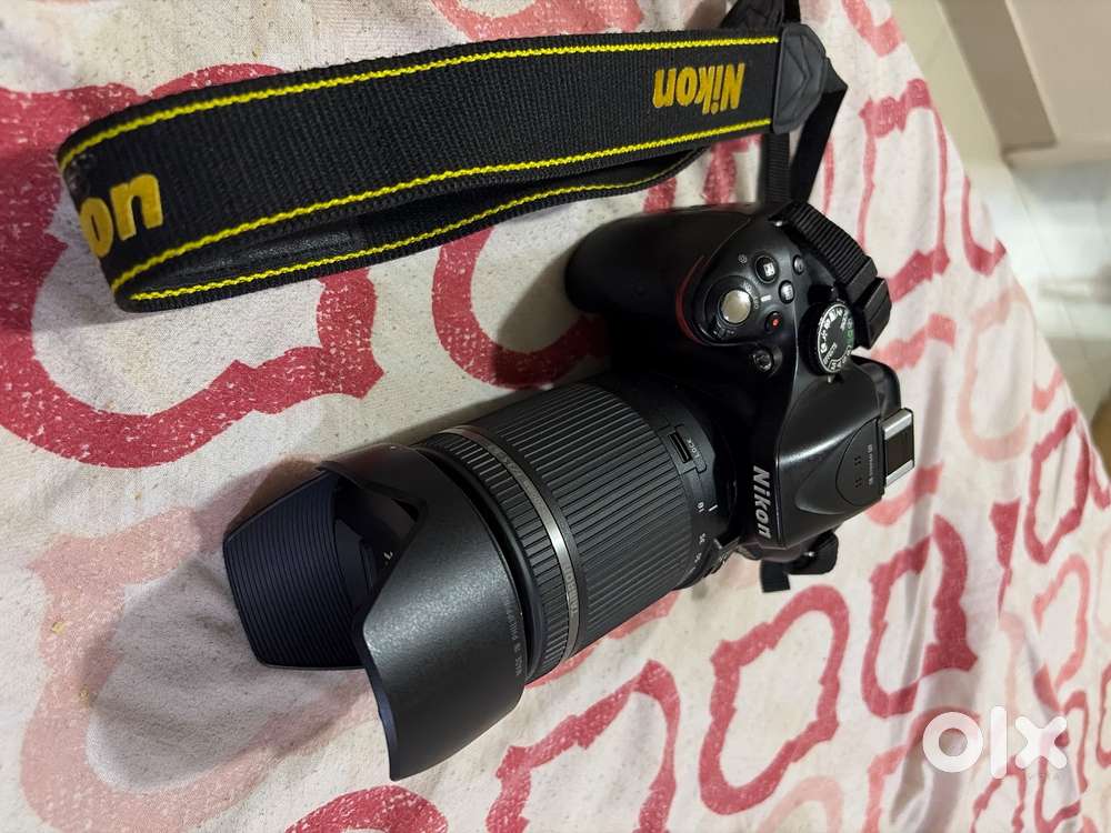 Nikon D5200 along with Nikon 50mm prime lens and Tamron 18-200 lens