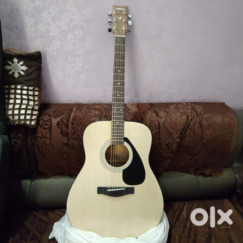 Yamaha acoustic guitar with cover bag , strap , picks