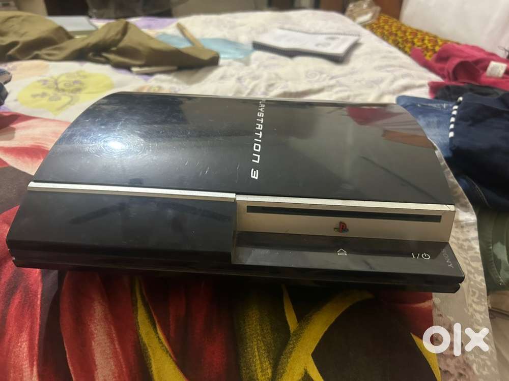 Ps 3 Along with 3 remotes and 4 games
