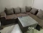 4 seater sofa with center table and 2 pcs puffy
