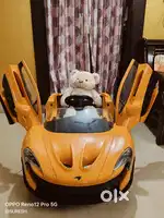 Available Now: Orange McLaren P1 Electric Ride-On Car for Kids