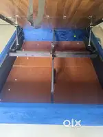 Upholstered bed with hydraulic storage