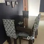 Four seater hard wood dining table