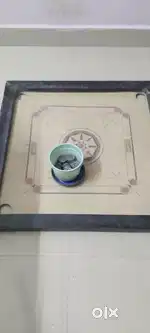 Carrom board with coins