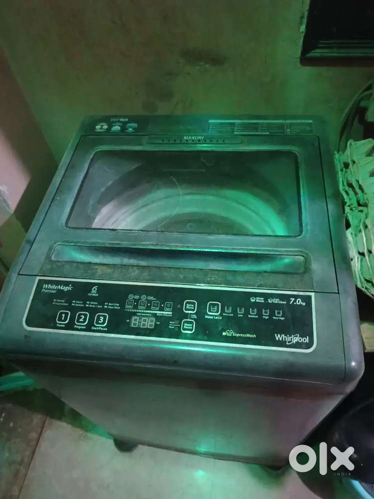 Whirlpool 7kg top load washing machine.