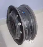 One Maruti Alto car wheel Rim, One looking glass