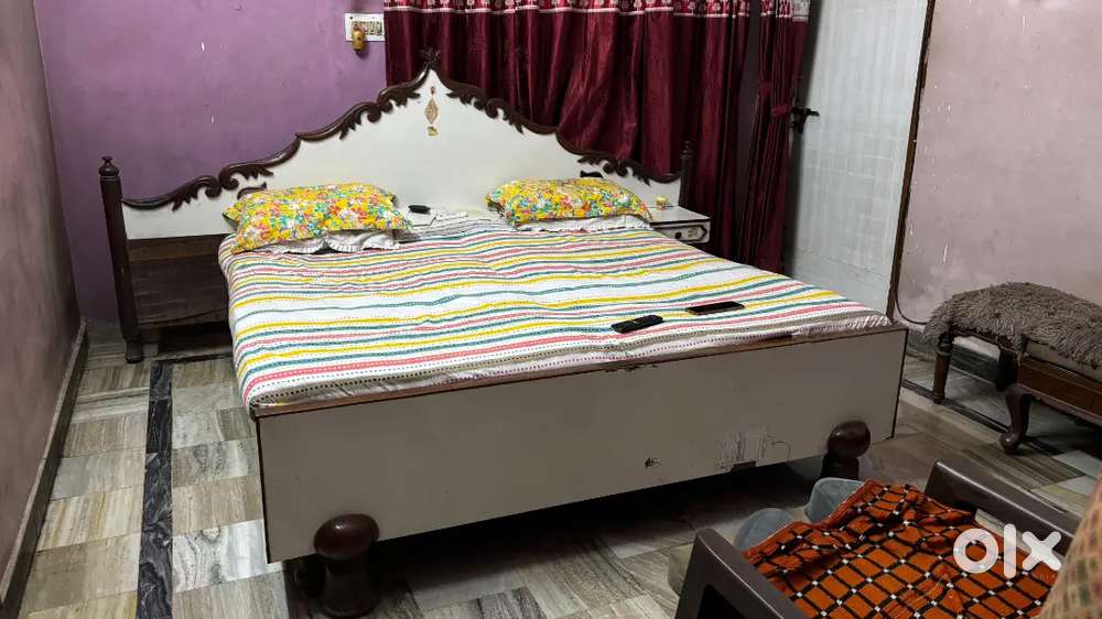 Classical double bed with carved headboard