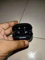 PTron TWS Earbuds one ear piece with the charger case and wire