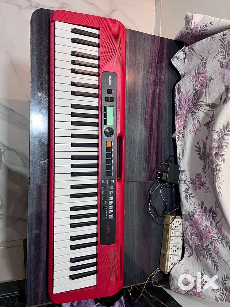 Its a keyboard in red colour casio ct-200 along with a bag