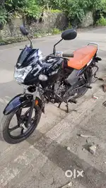 TVs sport bike next to o showroom condition