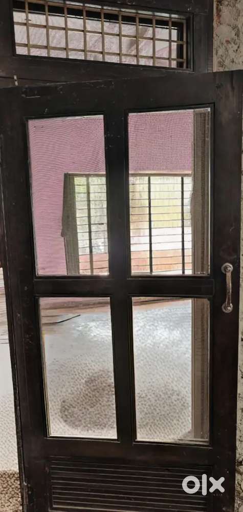 Double wooden doors and widows