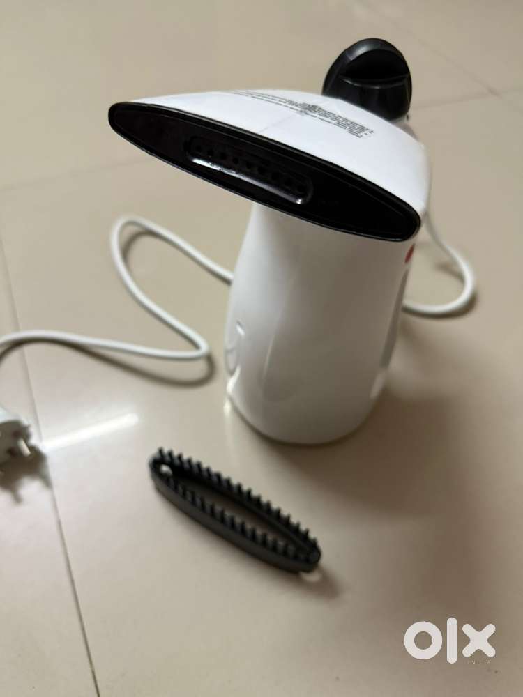 Handheld garment and facial steamer