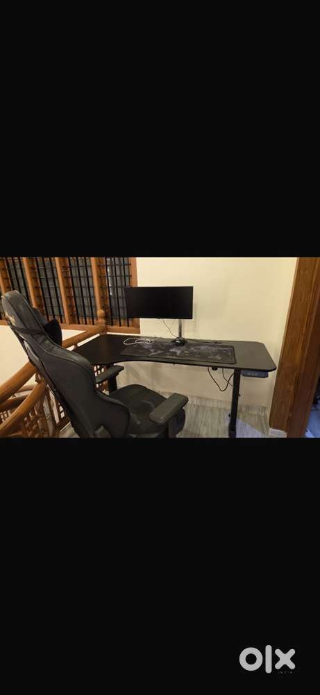 Gaming chair and elctronic adjustable table(price negotiable)