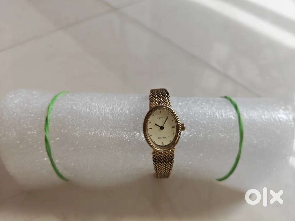 Titan girls  latest wrist golden watch.