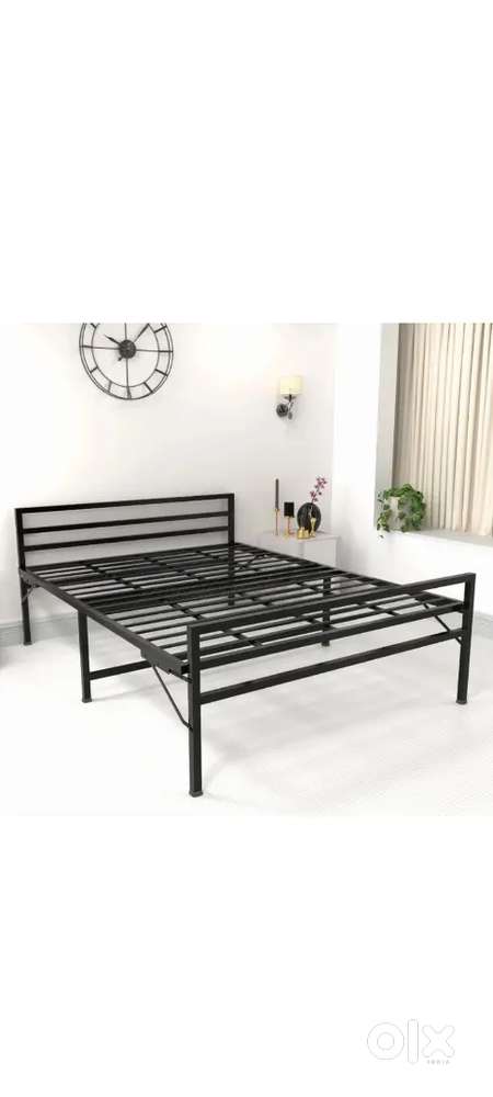 Newly purchased metal Queen size bed with mattress