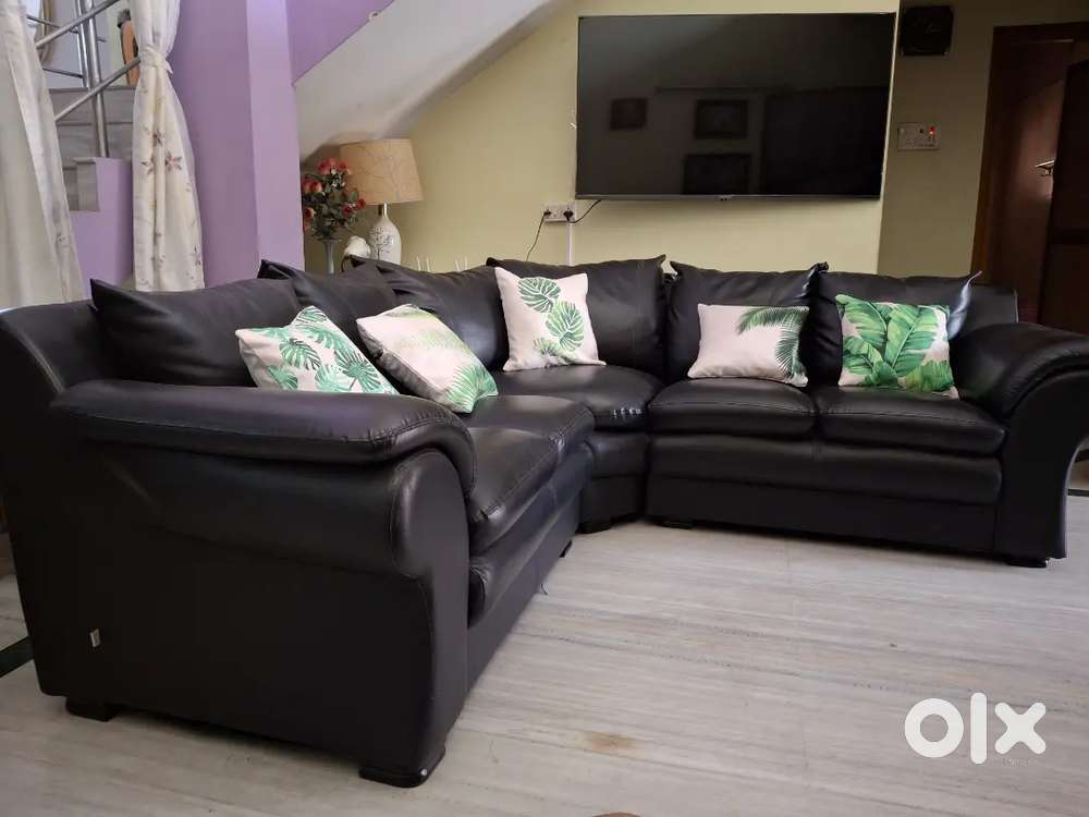 Sofa with leatherite black cover. L shaped.