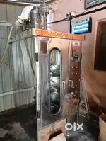 Bulk milk cooler and packing machine