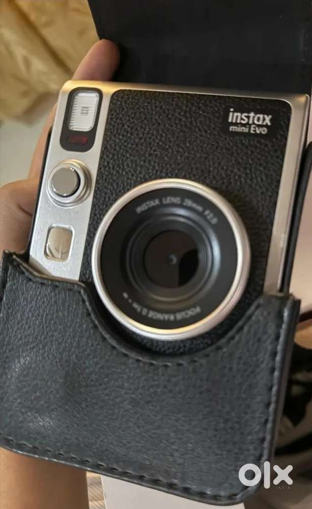 Instax mini EVO. Never used. With cover and extra 100 stone grey film.