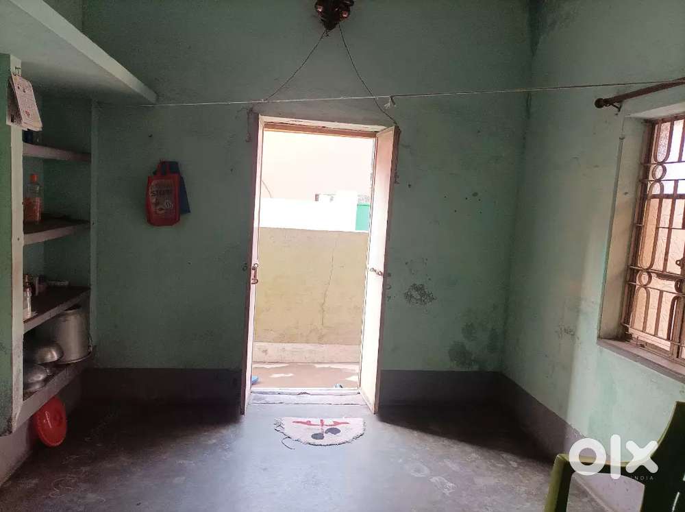 A room with a kitchen & bathroom latrine outside the room