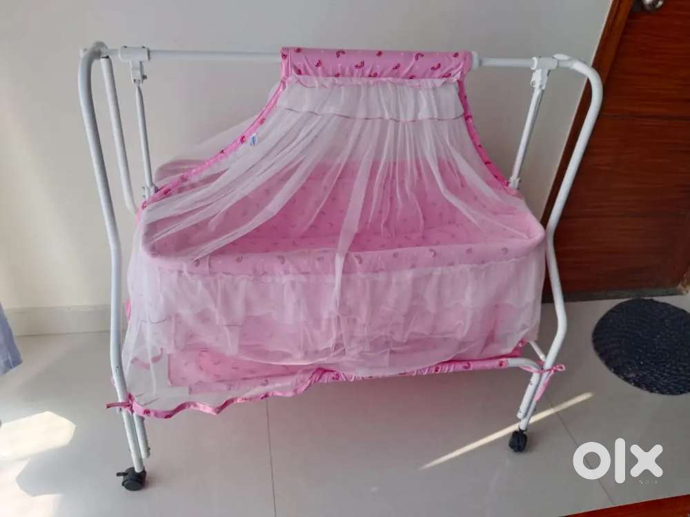 Baby cradle with mosquito net