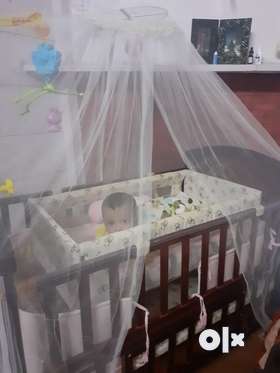 Wooden Baby cot with Jhula for infant along with bedding. It can be used uptill 4 yrs of age easily