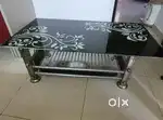 1 year old lightly used designer Glass Table with underside storage
