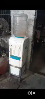 Voltas water cooler Dispenser with steel stand.