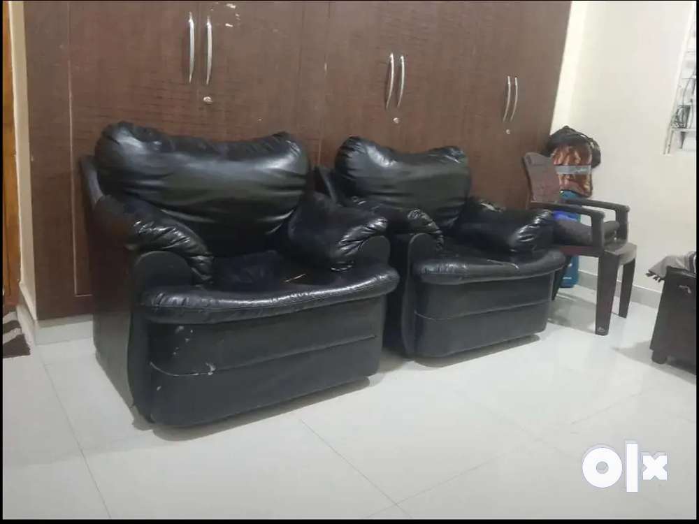 Two single Black leather sofa's