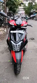 A TVS Ntorq 125 Race Edition dish brack bike is good condition