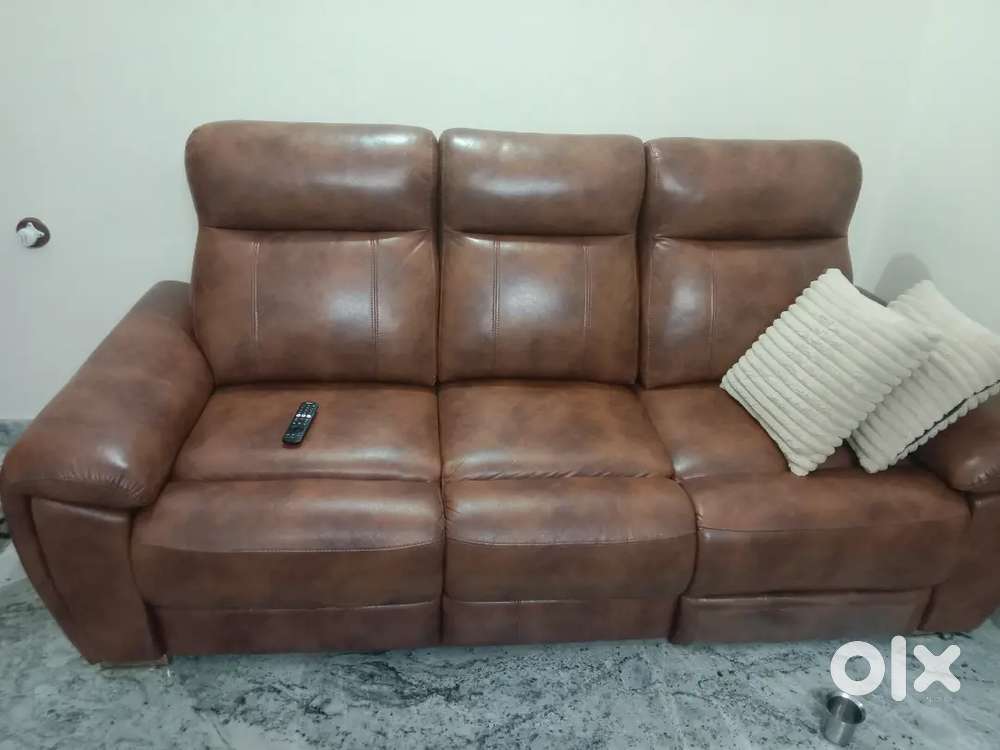 Leather sofa less than 6 months old with left side recliner