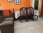 Teak wood Dining table with 6 cushioned chairs