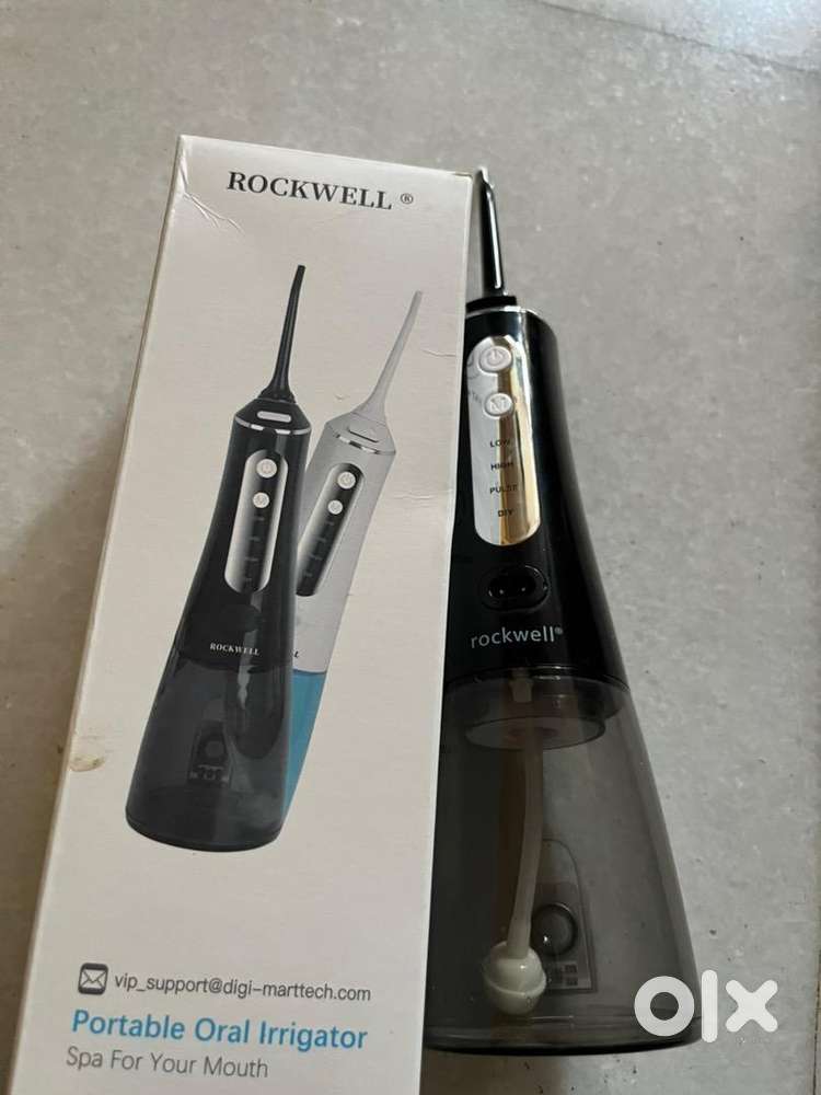 PORTABLE ORAL IRRIGATOR