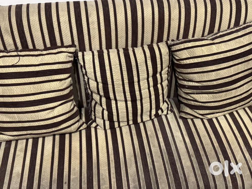 Three seater sofa with 3 pillows included price negotiable