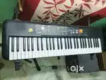Casio PSR F52 with snand and bag