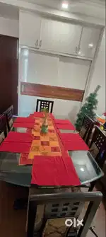 Teak wood glass top dining table with 6 chairs and Ddecor upholstery