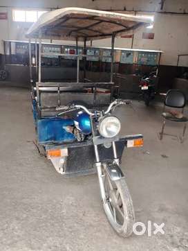 Byke Rickshaw loader and passenger
