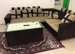L shape sofa and glass top dining table